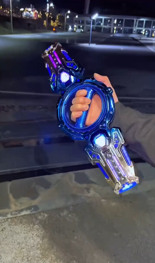 Retractable Light‑Up Spinning Saber Toy with Sound Effects for Kids