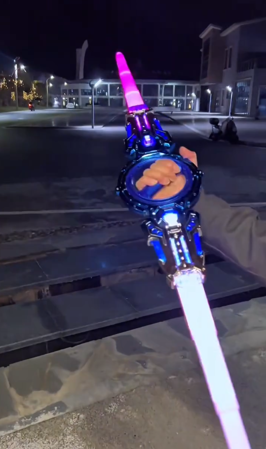 Retractable Light‑Up Spinning Saber Toy with Sound Effects for Kids