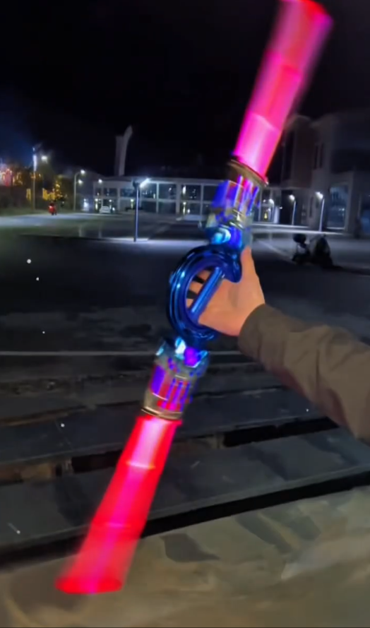 Retractable Light‑Up Spinning Saber Toy with Sound Effects for Kids